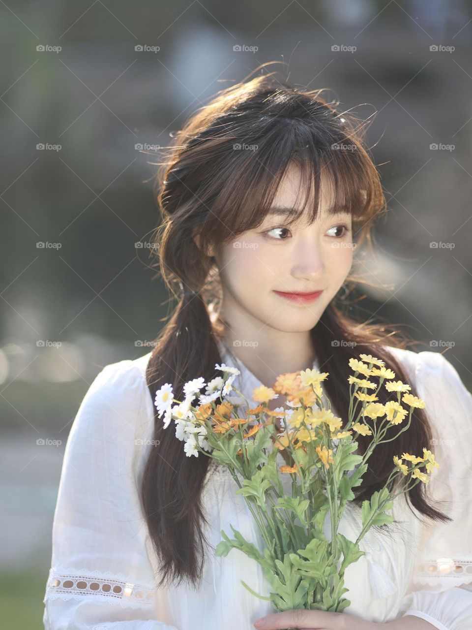 A girl holding flowers