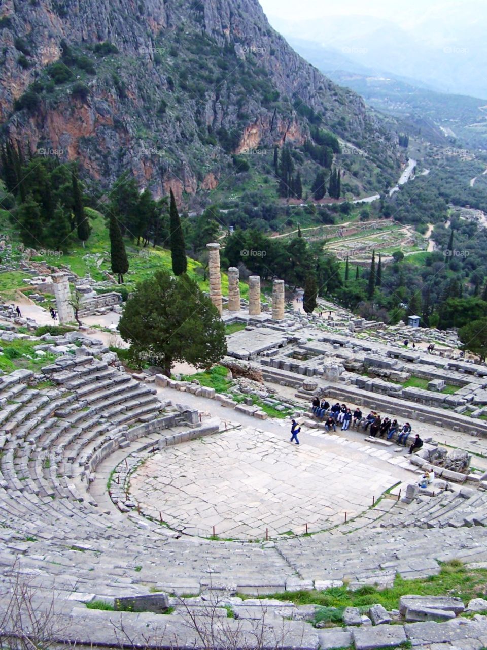 View of the Temple of Apollo from the amphitheater at Delphi, Greece; view of the sacred way, and Mount Parnassus