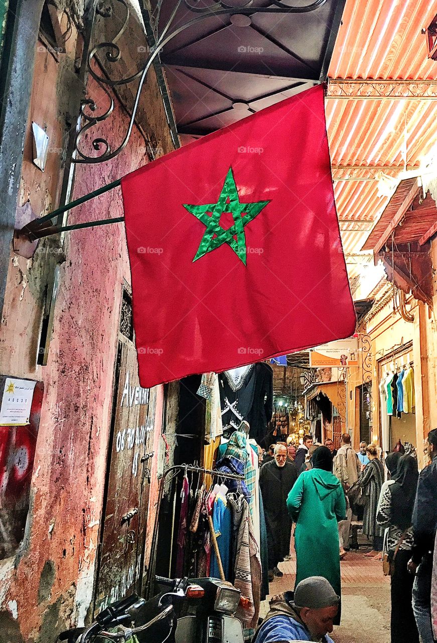 Moroccan flag flying high in the medina 