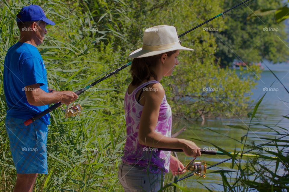 Father And Daughter Fishing For Fun