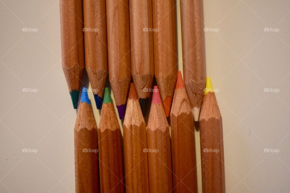 Colored pencils in a row