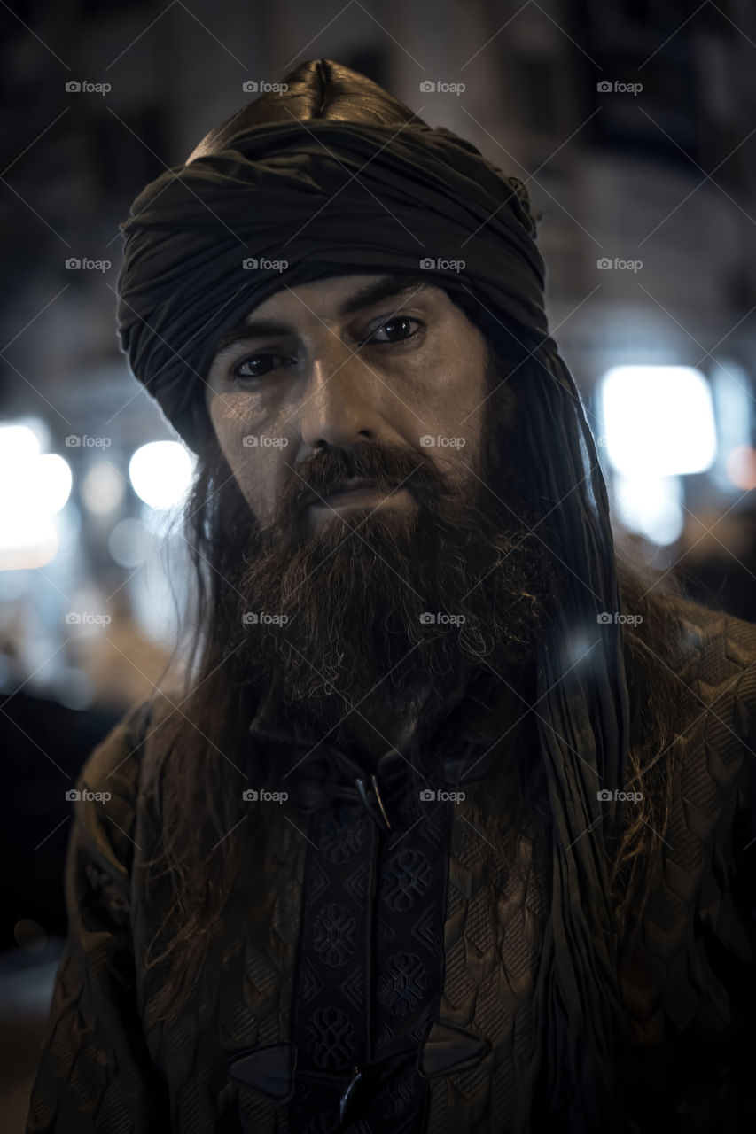 Bearded man in darkness