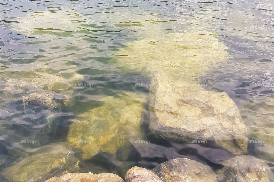 Granite rock sinking in water