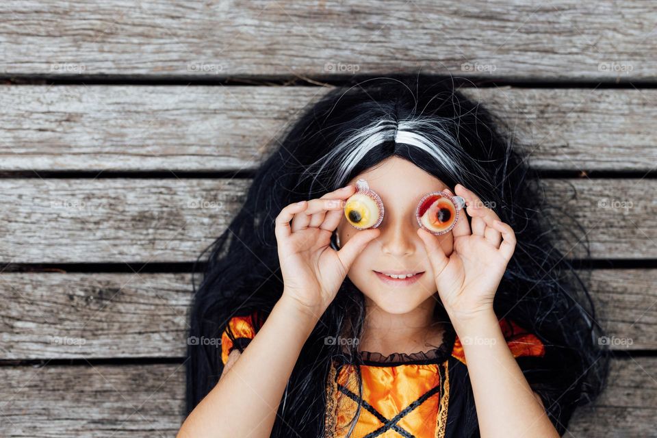 Kid celebrating Halloween outdoor 