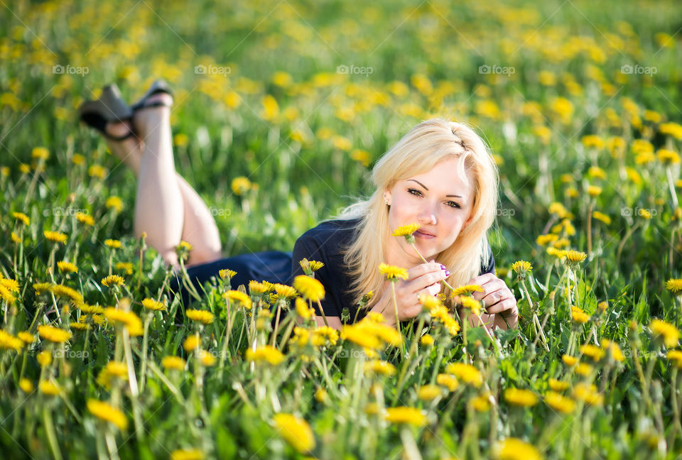 Blonde woman celebrating spring