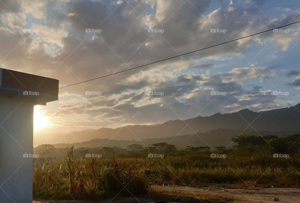 beautiful sunset on the plain, splendorous mountains and natural beauty