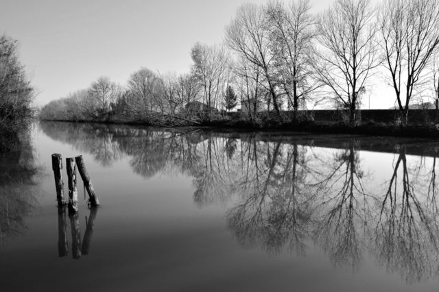 Countryside river view with water reflection , Italy
