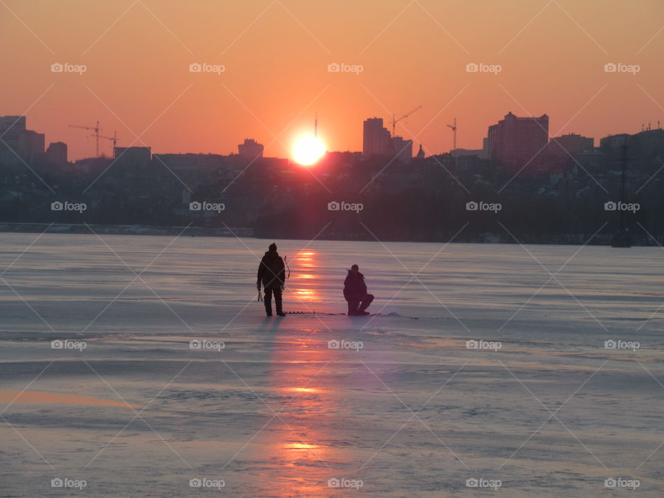fishermen at sunset