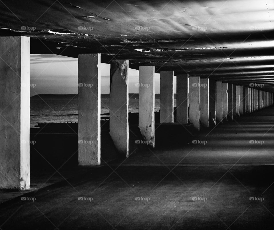 Pedestrian underpass, Bottle Alley, that runs along Hastings seafront at night