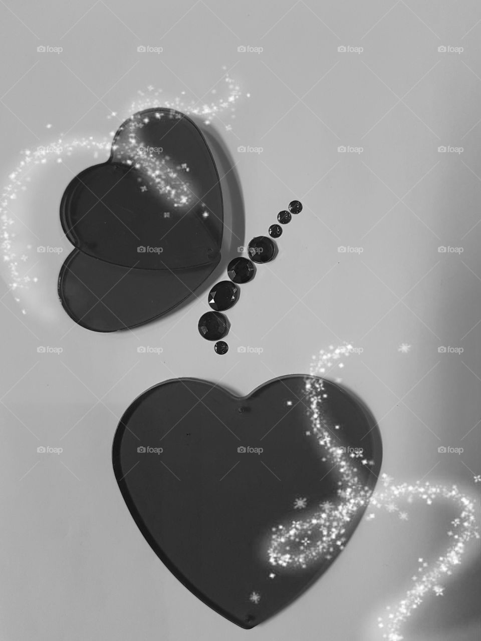 Black and white.  heart and butterfly arrangement with a splash of silver star dust.