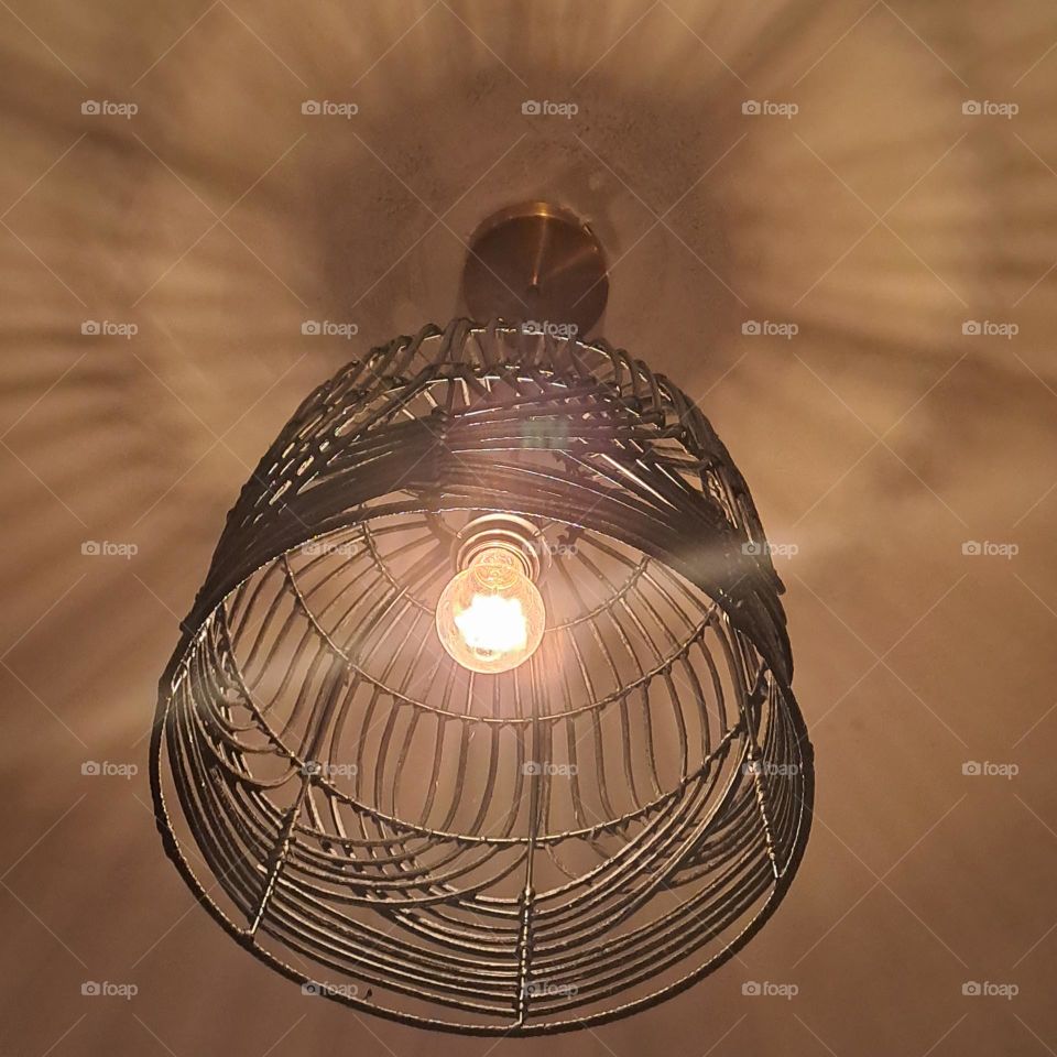 ceiling light metal with shawow cated onto ceiling