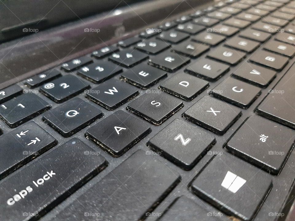 A black buttons of keyboard of a laptop