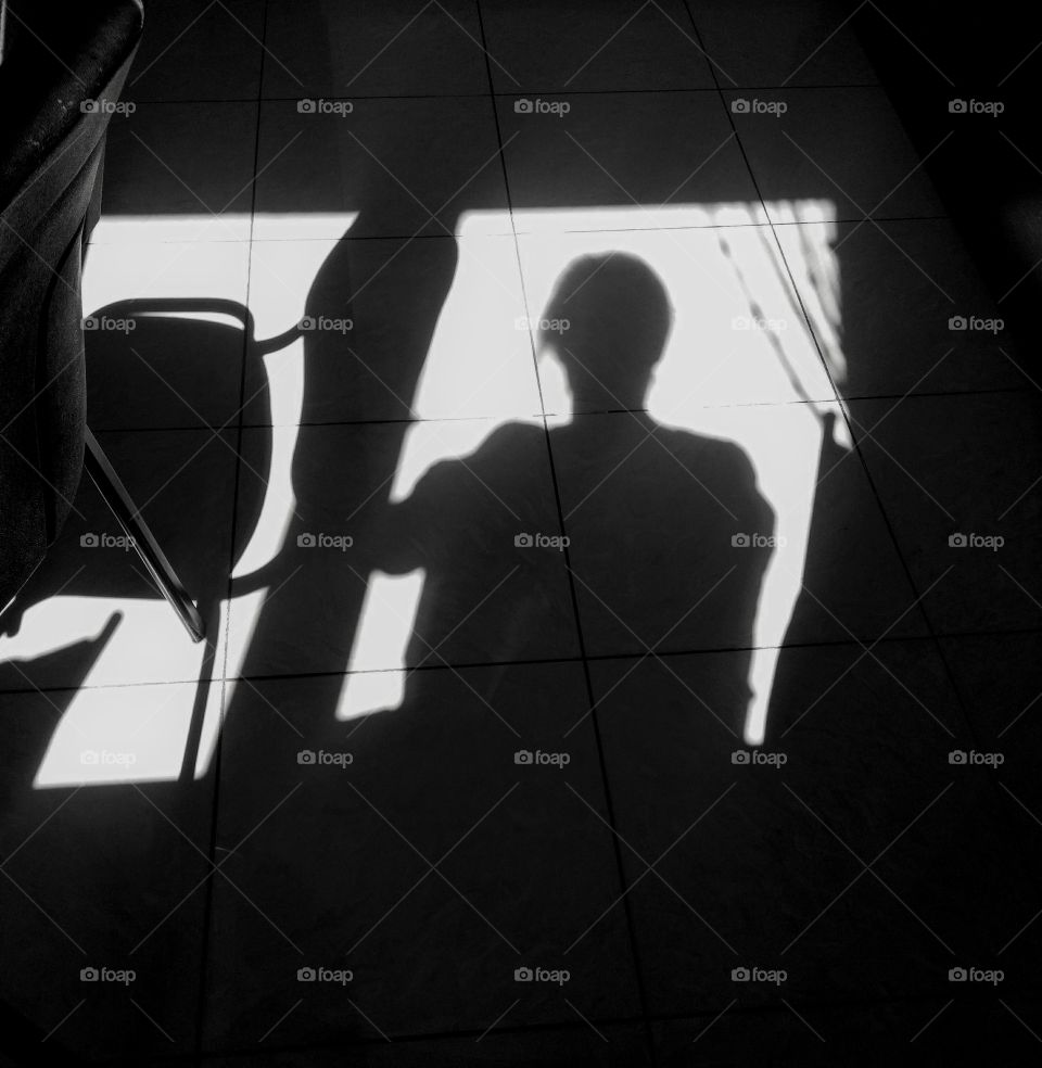 light and shadows person on a window view