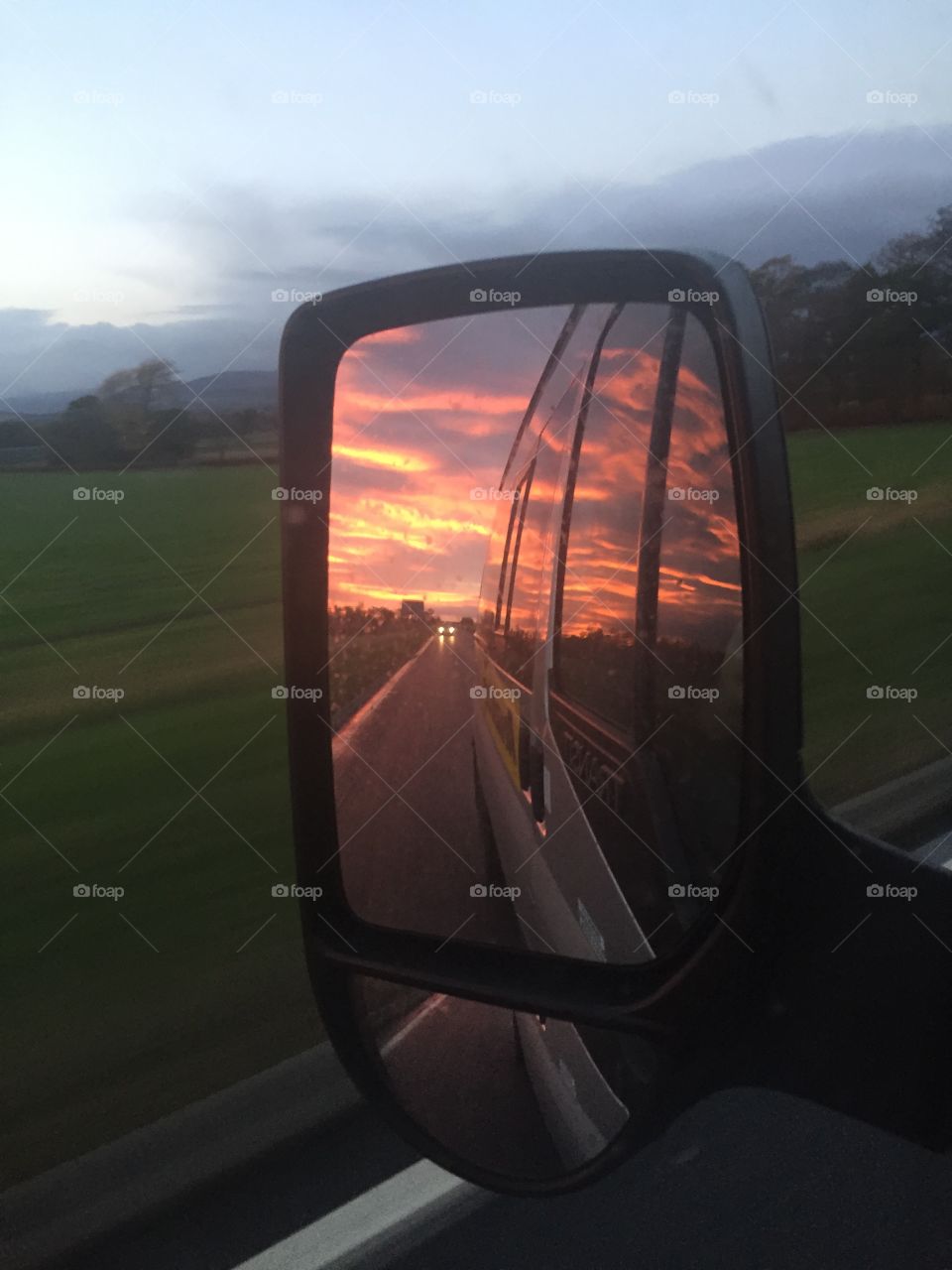 Sunset in the wing mirror