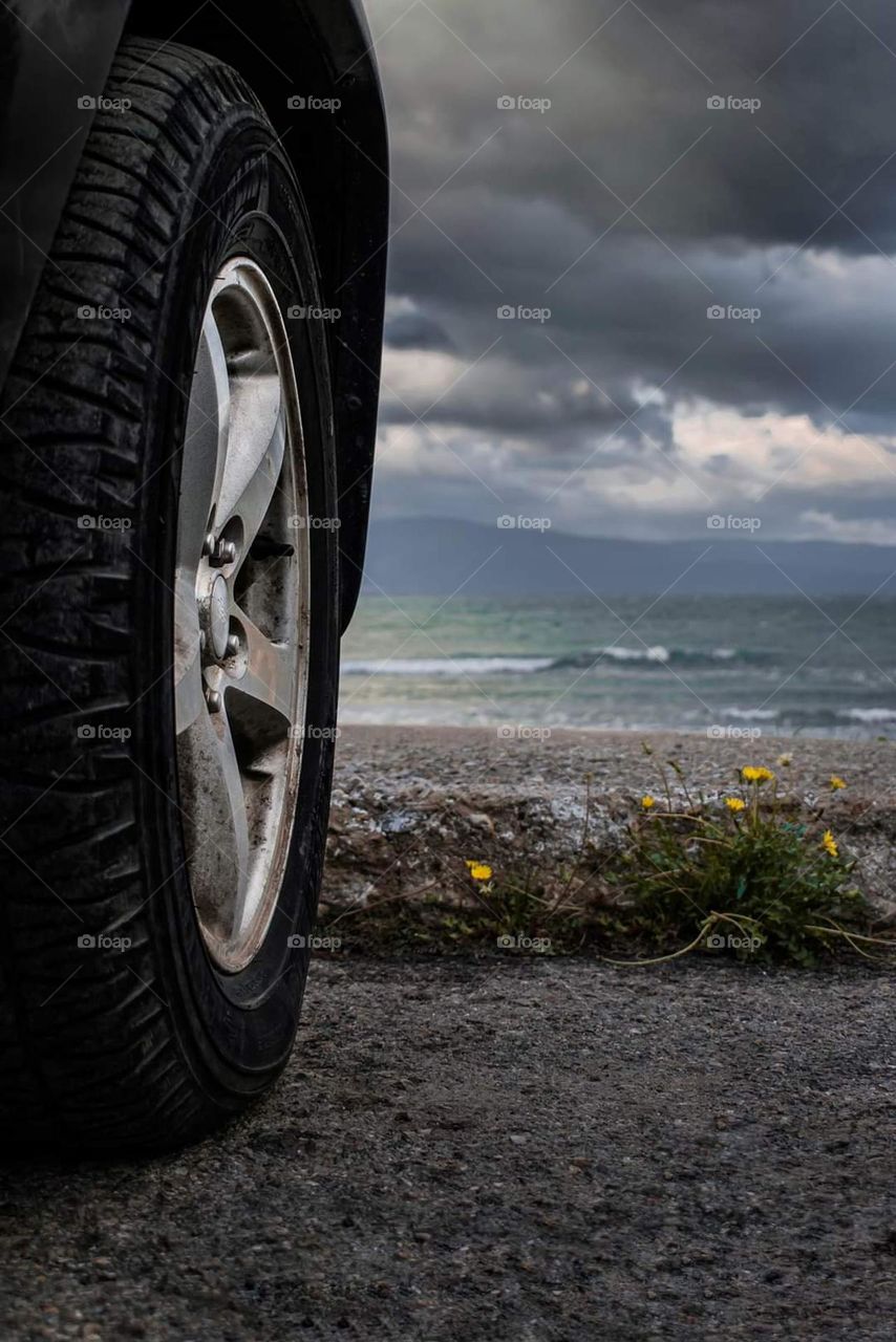 My car is standing in front of the sea before the storm.