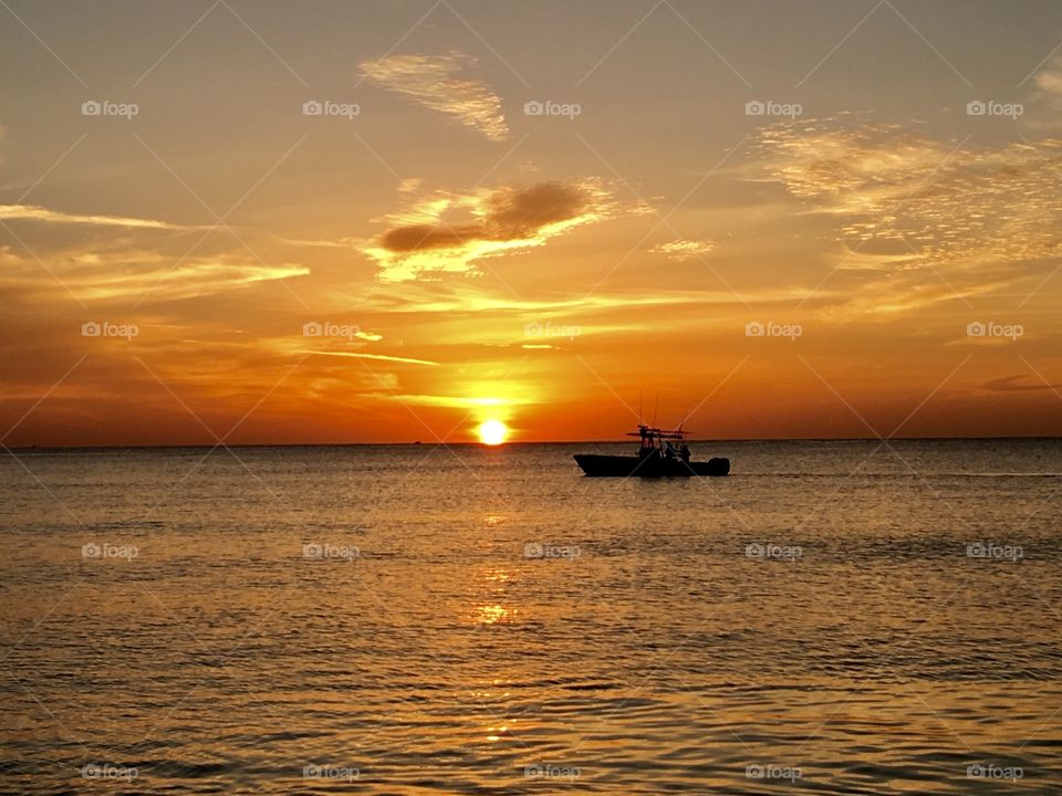 Sunrise & a boat in Deerfield Beach, Florida. 