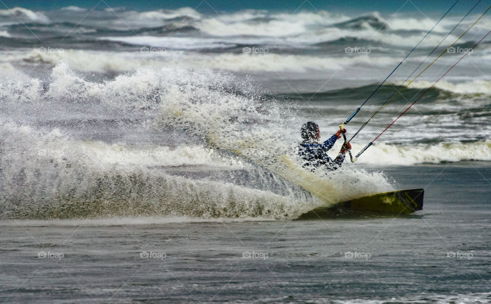 Kitesurfing on a stormy day. Netherlands. 