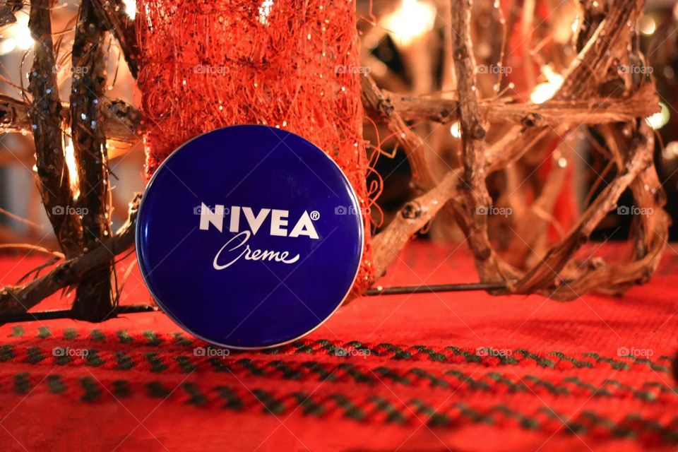 Nivea Crème Lotion by Christmas lights red