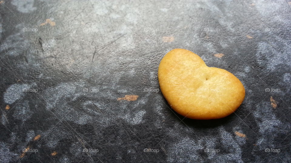Heart cracker. mini crackers on kitchen surface