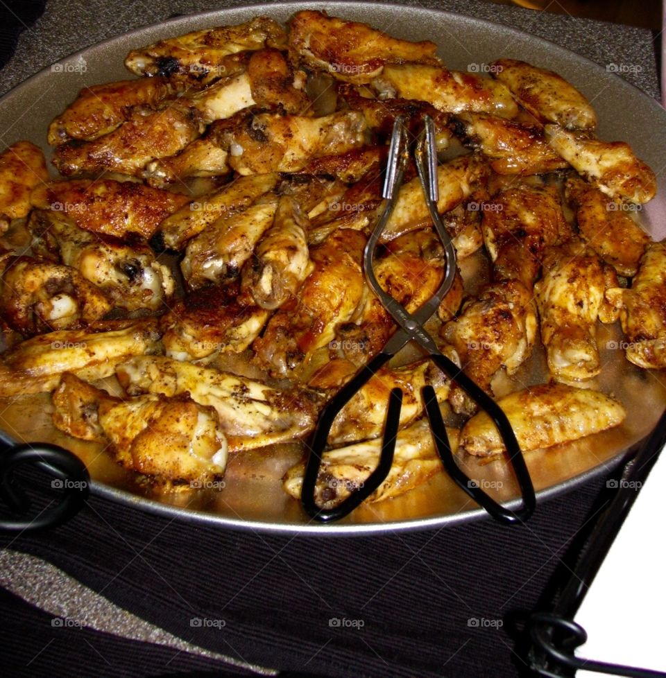 Chicken Wings. Grilled chicken wings on a platter