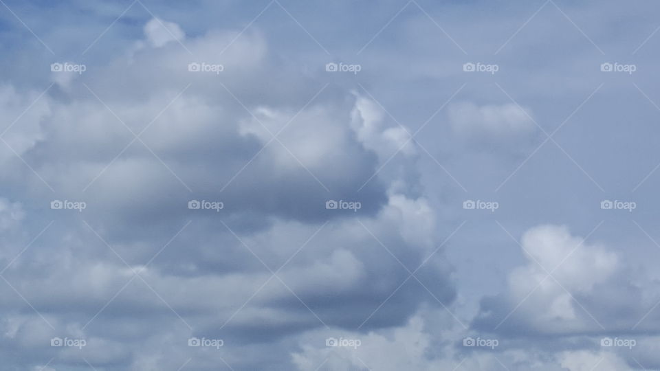 Ominous looking clouds race through the sky.