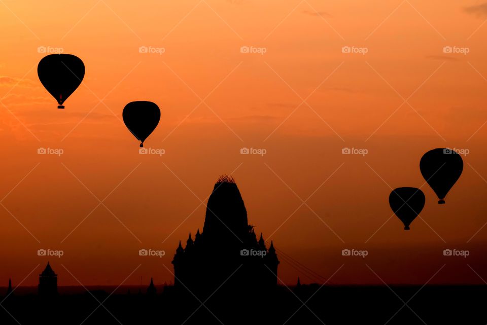 Floating of balloon above pagoda