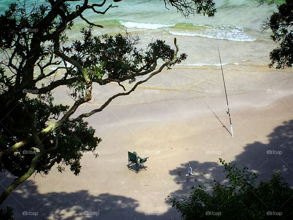 Fishing on an isolated beach