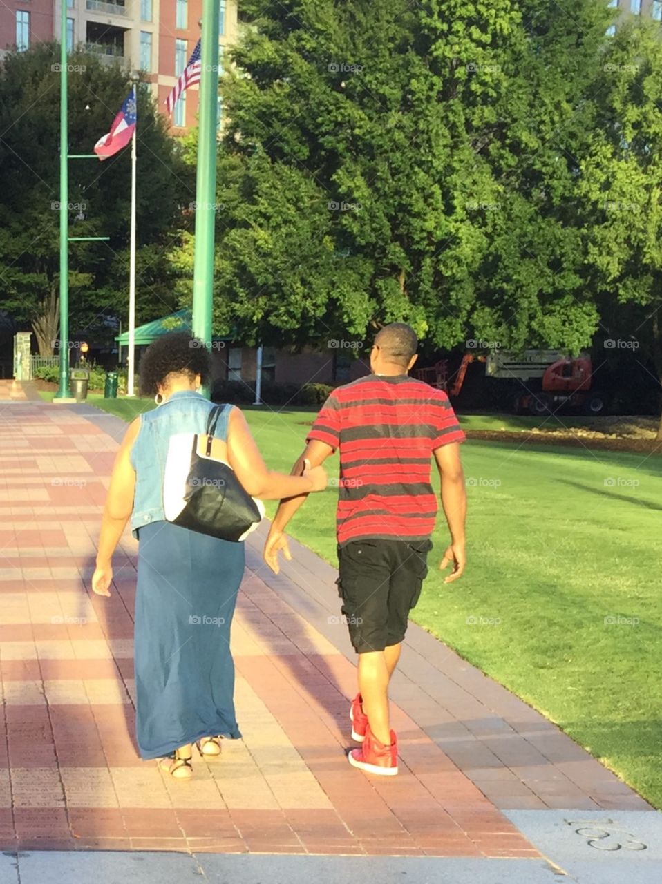 Couple walking . Behind every successful man is a woman. She is supportive caring and loving as she helps her husband walk 