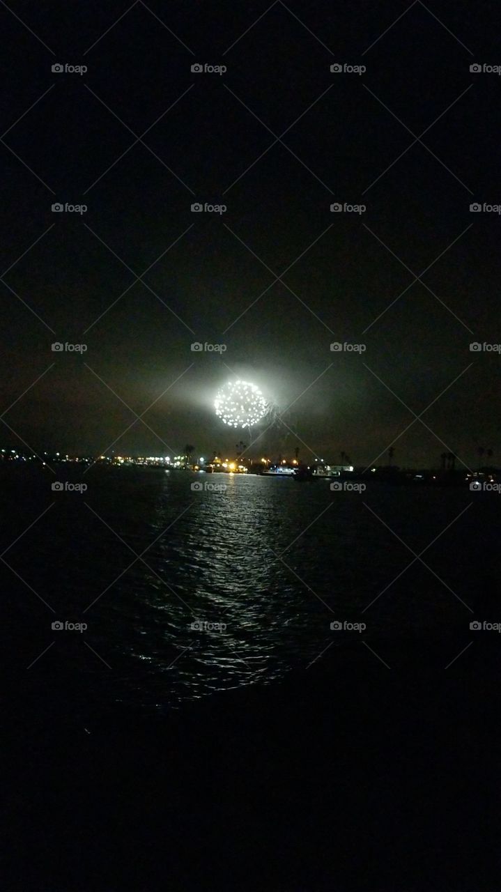 Light up the sky on the 4th of July ! America the Beautiful. God Bless America. Fireworks by the Pacific Ocean.