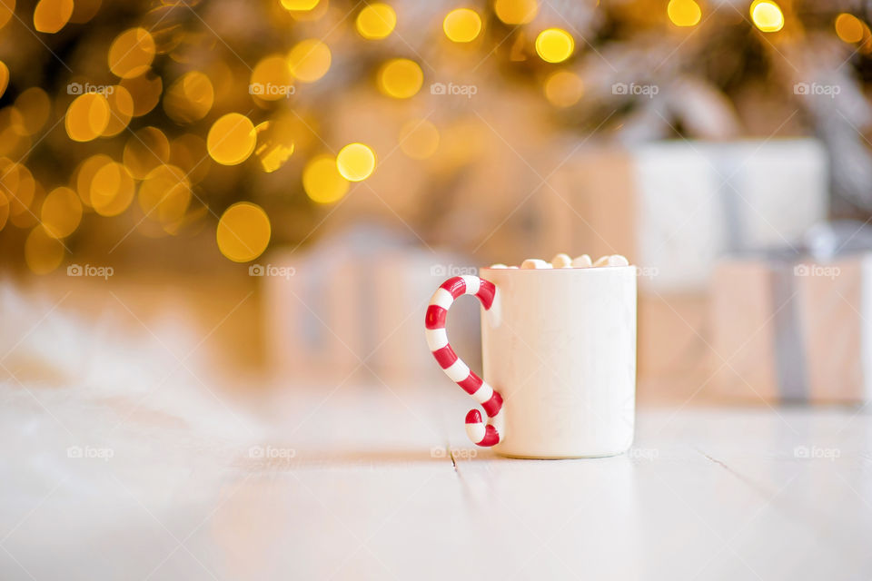 cup of coffee in a cozy festive Christmas atmosphere