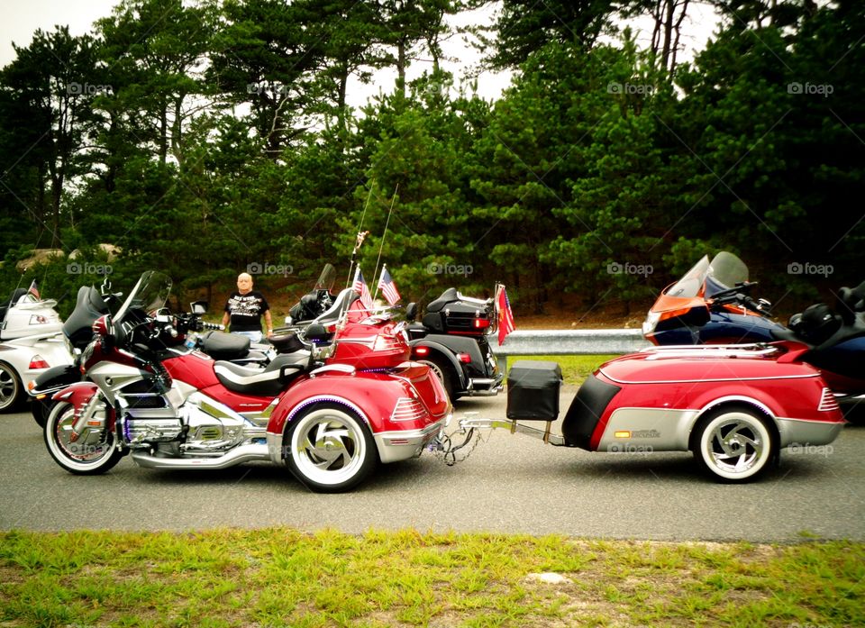 Custom red trike motorcycle & matching red trailer.