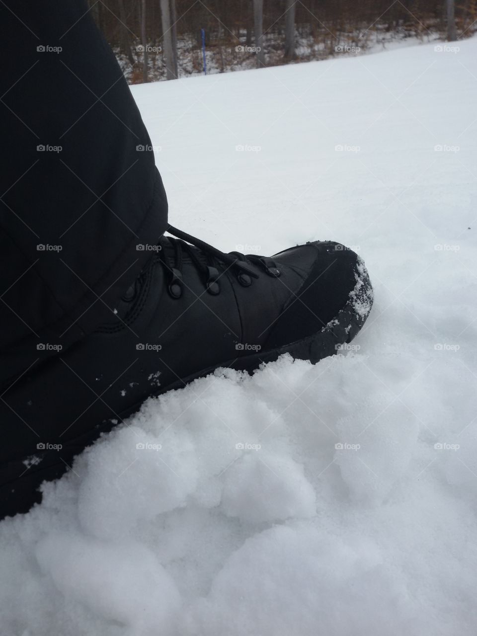 male winter boot in snow