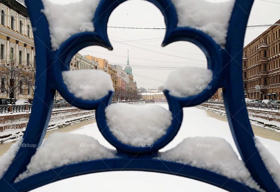 The beginning of winter in the city ❄️ View of the river and city buildings through the bridge grid ❄️St.Petersburg, Russia