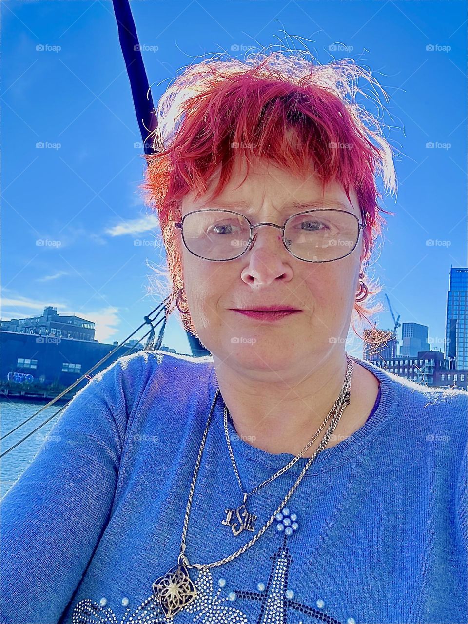 This is me, “Petra Schiller” a.k.a. “Maxine Firefox” with fire red hair glowing in the late afternoon sun aboard “Salvation”, the “28 ft 1969 Luhrs” cabin cruiser at “Newtown Creek” in LIC, Queens we call home. 2023. Hypnotic Productions