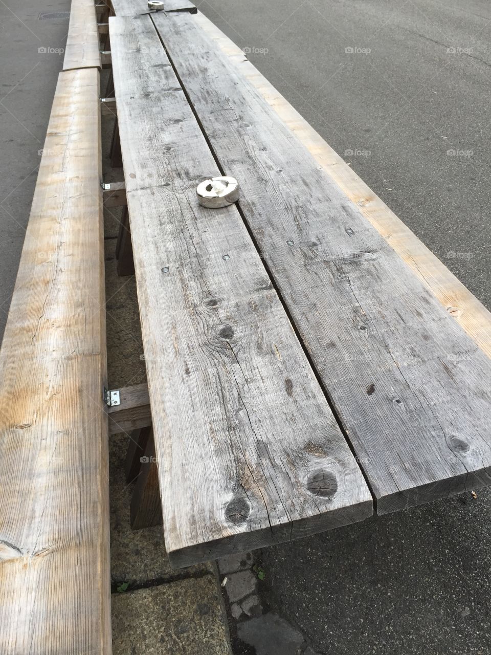 Grey table and bench on the street