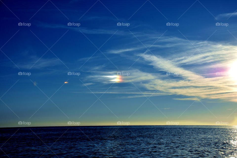 Rainbow behind clouds