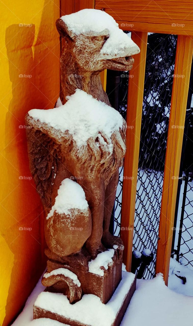 statue covered in snow