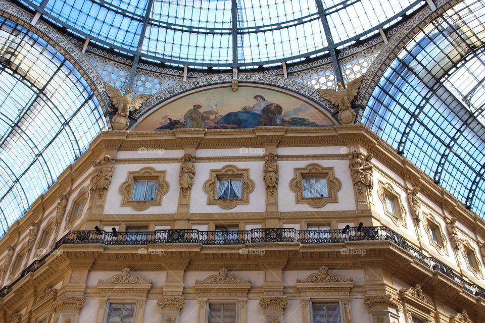 Neo-Renaissance style fasade and roof details og Galeria Vittorio Emanule in Milan.  Italy