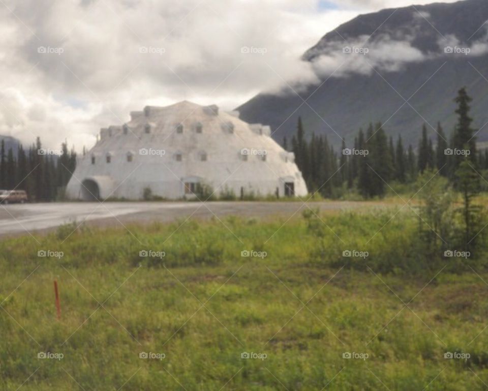 Traveling in Alaska, passing an "Igloo"