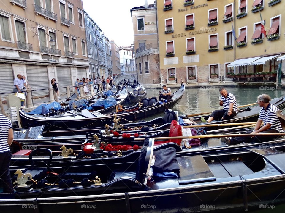 Venice , is built on more than 100 small islands in a lagoon in the Adriatic Sea. It has no roads, just canals – over 400 bridges linking the islands , this photo shows the architecture, canal, Gondolas and Gondolier’s , truly beautiful and unique