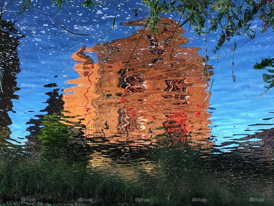 Ripples in the city … river moving creating a wobbly reflection