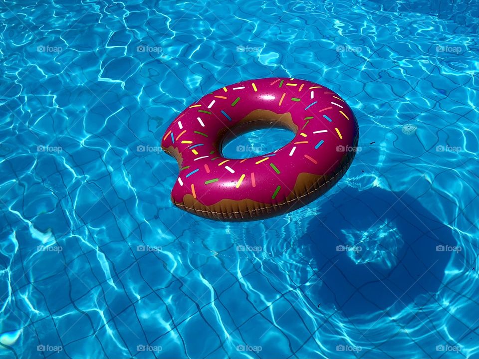 Inflatable ring float in the pool
