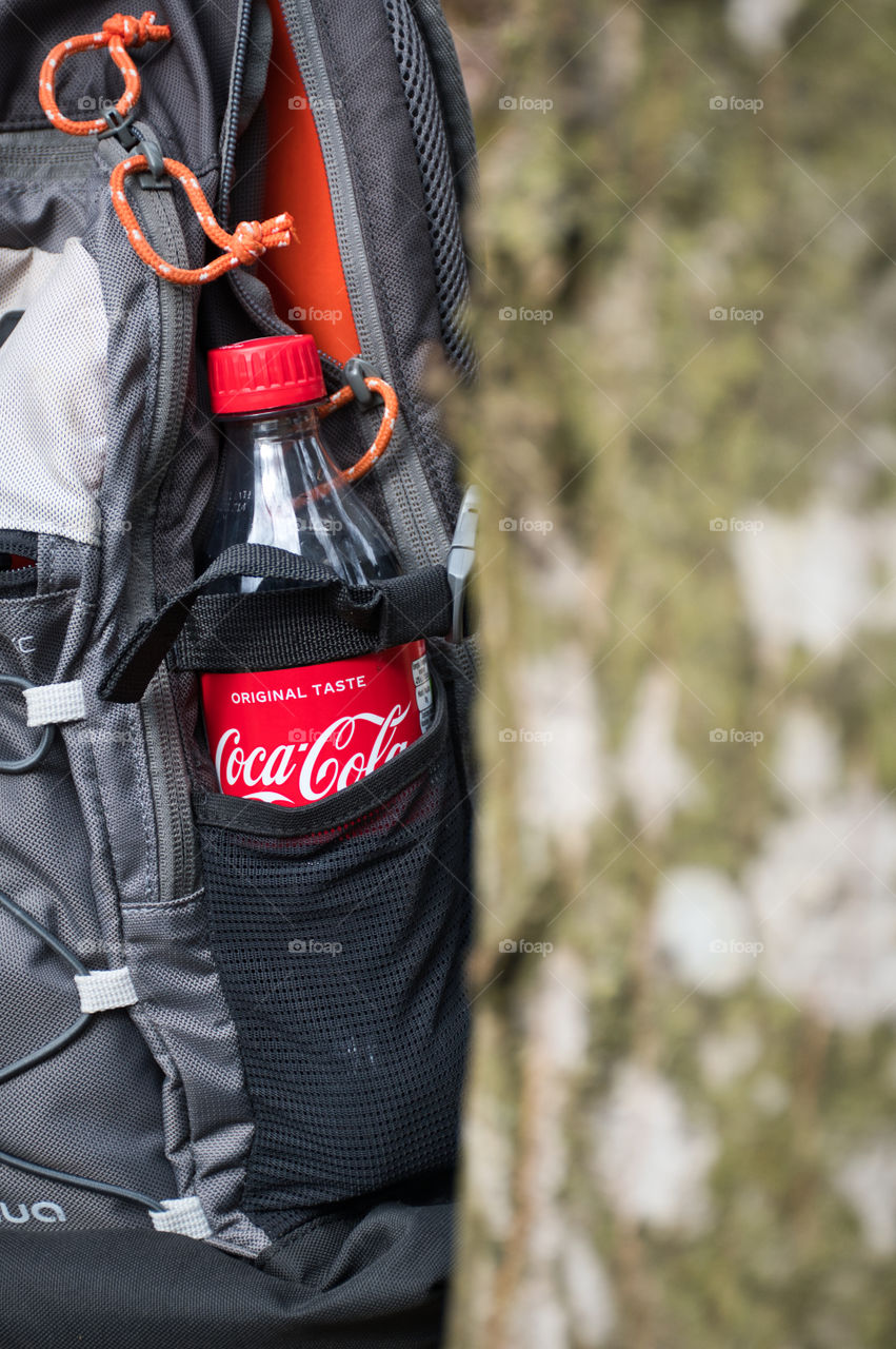 Coca cola in the backpack