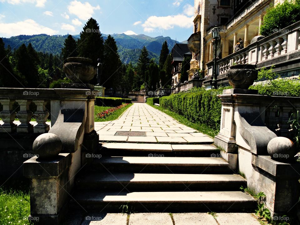 Let's take a walk on the Peles Castle's alley. You have a great mountain view and you can admire the architecture of this beautiful castle.