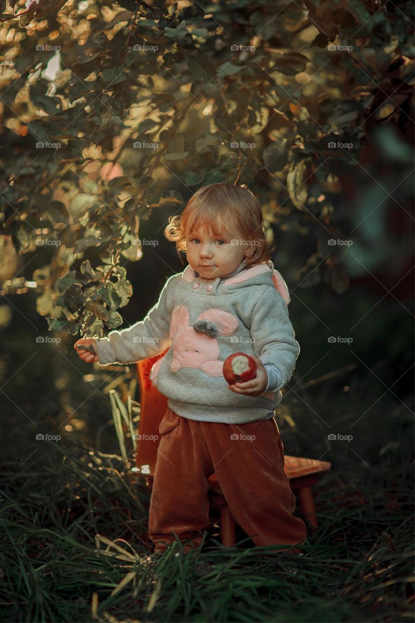 Little girl portrait with apple