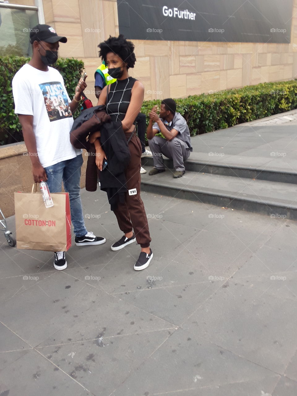 A couple and others  outside the  complex