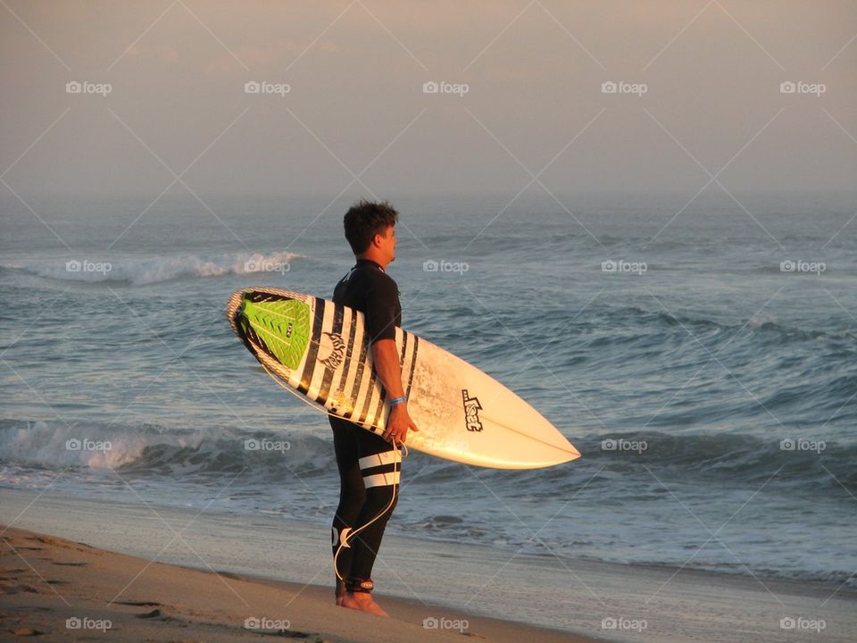 Surfer Spotting the Waves