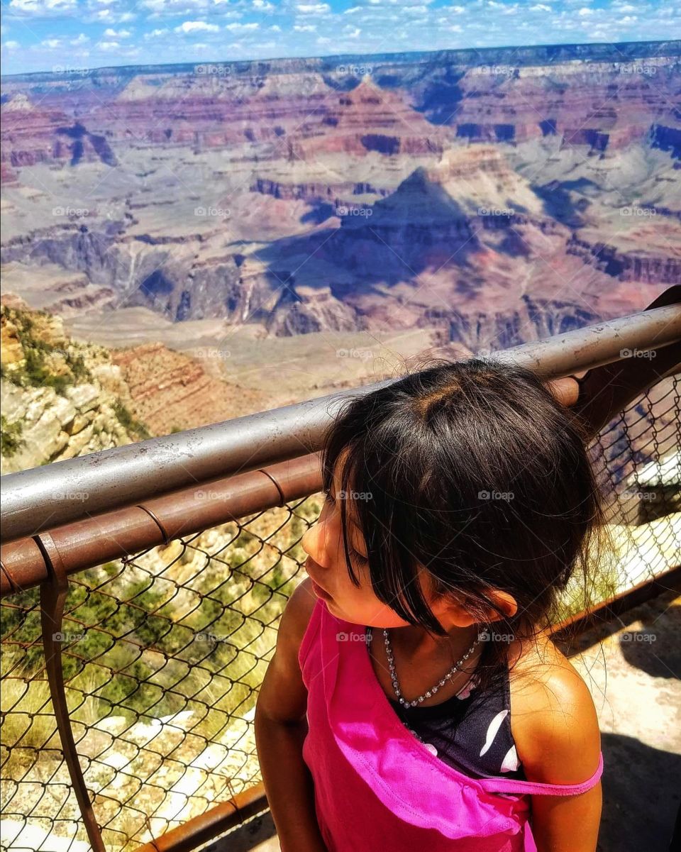 She walked up to the edge trying to touch the "picture"...