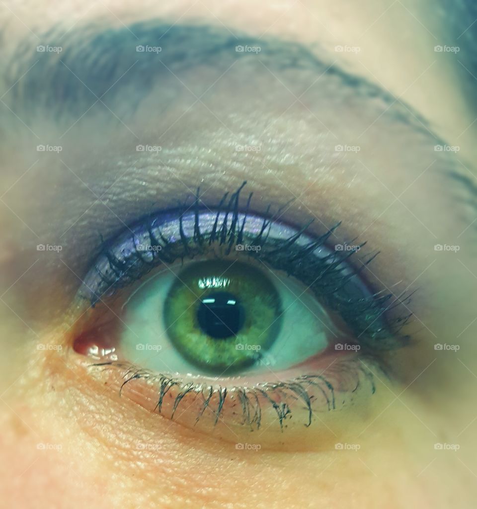 Purple eyeshadow and my green eye.
