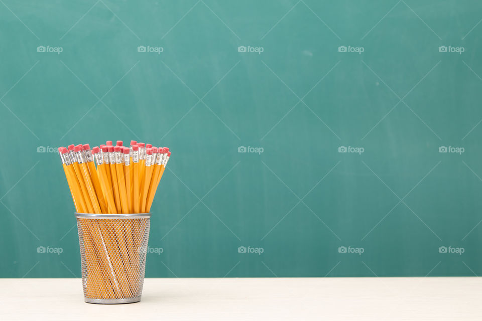 group of pencils and chalkboard